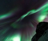 Northern lights above mountain