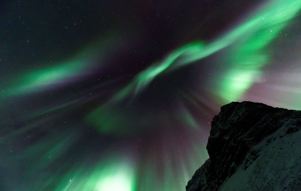 Northern lights above mountain